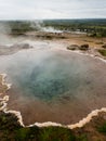 Steaming colorful hot spring pool in Geysir geothermal area Royalty Free Stock Photo