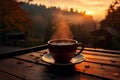 A steaming cup of black coffee, backlit by the morning sunrise.