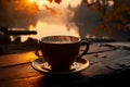 A steaming cup of black coffee, backlit by the morning sunrise. Royalty Free Stock Photo