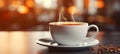 Steaming cup of coffee on table with blurred background, perfect start to a bright morning
