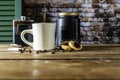 Steaming cup of coffee cigarettes and fruit cookies