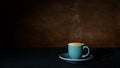 Steaming cup of hot coffee against dark background Royalty Free Stock Photo