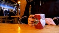 Steaming Cup of Hot Mulled Gluehwein at German Market in British Town