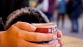 Steaming Cup of Hot Mulled Gluehwein at German Market in British Town