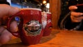 Steaming Cup of Hot Mulled Gluehwein at German Market in British Town