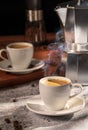 Steaming Espresso in White Demmitasse Cups with Moka Pot