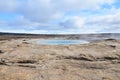 Steaming geysir in Iceland with mineral deposits around it Royalty Free Stock Photo