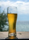 A steaming glass of beer stands on the bar