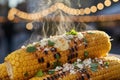 Steaming grilled corn on the cob with toppings Royalty Free Stock Photo