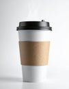 Steaming Hot White Disposable Coffee Cup with Black Lid and Cardboard Sleeve Royalty Free Stock Photo