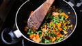 Steaming mixed vegetables in a pan