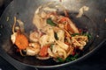 steaming mixed vegetables in the wok, asian style cooking vegetarian and healthy, selected focus.