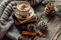 Cozy Winter-Themed Table with Hot Cocoa and Books Royalty Free Stock Photo