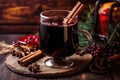 steaming mulled wine in a glass mug with cinnamon sticks