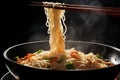 Steaming noodles on black background, held by chopsticks, a culinary delight