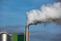 Steaming Pipe on Blue Sky Background Royalty Free Stock Photo