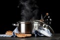 Steaming pot on black background Royalty Free Stock Photo