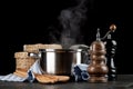 Steaming pot on black background Royalty Free Stock Photo