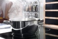 Steaming pot on electric stove in kitchen Royalty Free Stock Photo