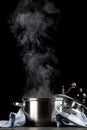 Steaming pot on black background Royalty Free Stock Photo