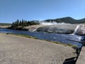 Steaming water flowing into a river at Yellowstone National Park