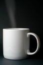 Steaming white mug