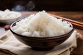 Steaming white rice in a bowl, a simple and satisfying meal