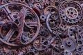 Steampunk background, machine and mechanical parts, large gears and chains from machines and tractors. Royalty Free Stock Photo