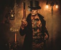 Steampunk man with gun on vintage steampunk background Royalty Free Stock Photo