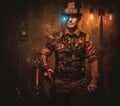 Steampunk man with gun on vintage steampunk background Royalty Free Stock Photo