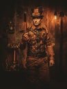 Steampunk man with gun on vintage steampunk background Royalty Free Stock Photo