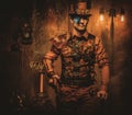 Steampunk man with gun on vintage steampunk background Royalty Free Stock Photo