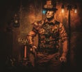 Steampunk man with gun on vintage steampunk background Royalty Free Stock Photo