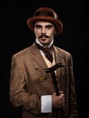 Steampunk man in a hat and with a cane. Royalty Free Stock Photo