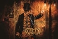 Steampunk man with Tesla coil on vintage steampunk background Royalty Free Stock Photo