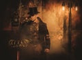 Steampunk man with Tesla coil on vintage steampunk background Royalty Free Stock Photo