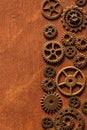 Steampunk mechanical cogs gears wheels on wooden background Royalty Free Stock Photo