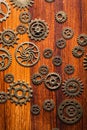 Steampunk mechanical cogs gears wheels on wooden background Royalty Free Stock Photo