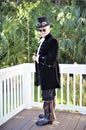 Steampunk Pirate poses for a photograph on the veranda
