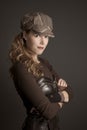 Steampunk woman wearing a brown corset with arms crossed Royalty Free Stock Photo