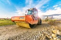 Steamroller performing road paving works