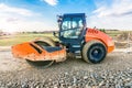 Steamroller performing road paving works