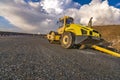 Steamroller performing road paving works