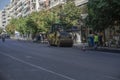 Steamroller presses asphalt at road.