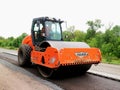 Steamrollers and road machinery working - laying asphalt