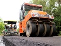 Steamrollers and road machinery working - laying asphalt
