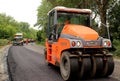 Steamrollers and road machinery working - laying asphalt