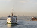 A ferry carrying passengers in istanbul at sunset