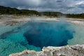 Steamy blue post-volcanic pool in Yellowstone Royalty Free Stock Photo