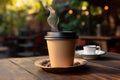 Steamy coffee in a cup, placed on a wooden surface